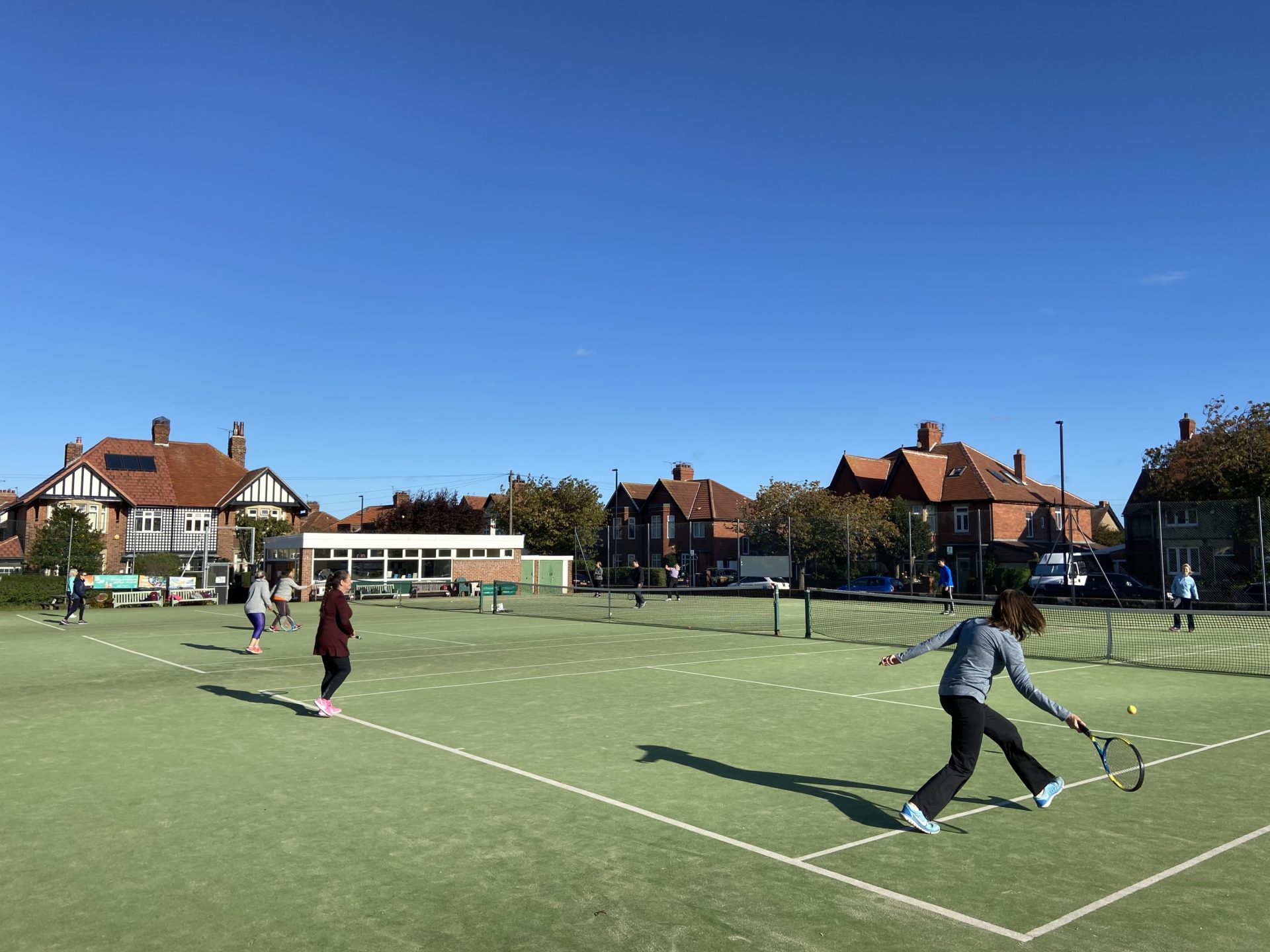 Players enjoying a social tennis session